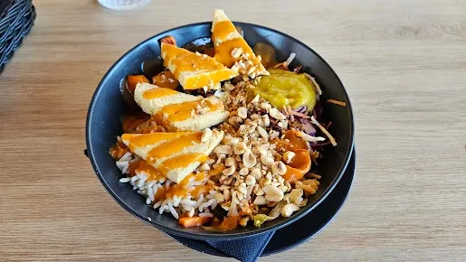 Fresh vegan Asian Bowl with rice and tofu at Tavči Kuhna